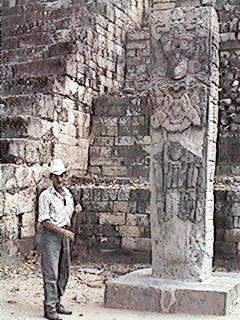 Our guide next to a Mayan estela